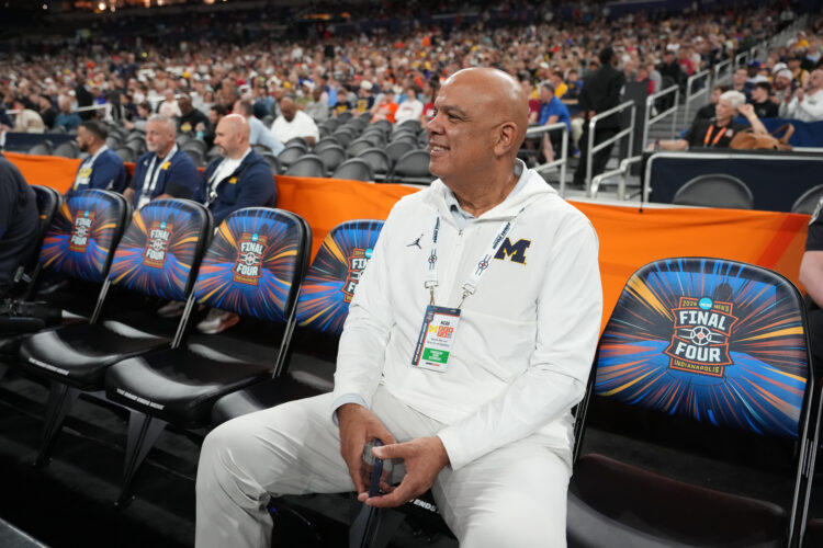 Michigan rolls in hoops and hockey but a football scandal leaves the athletic director on thin ice